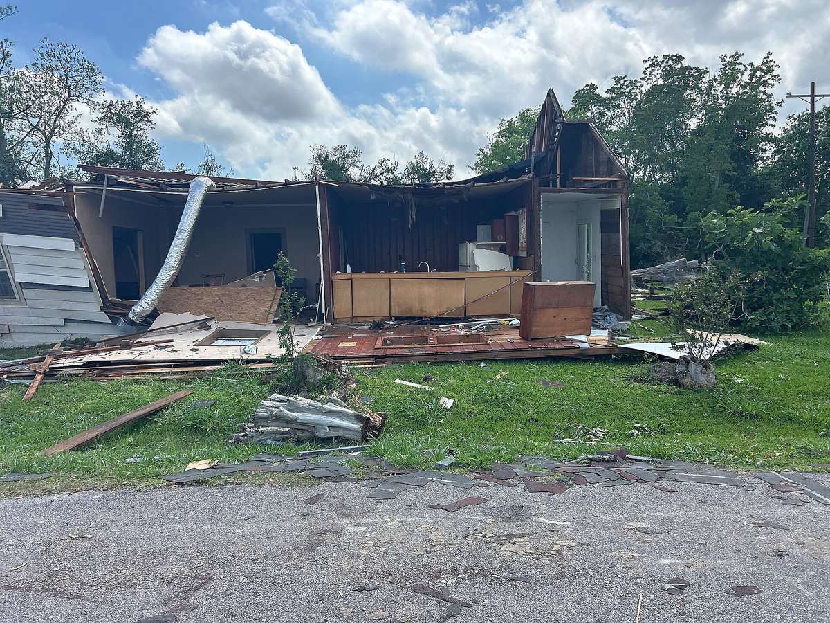 A Port Arthur house with its roof and most of its walls torn away by a tornado